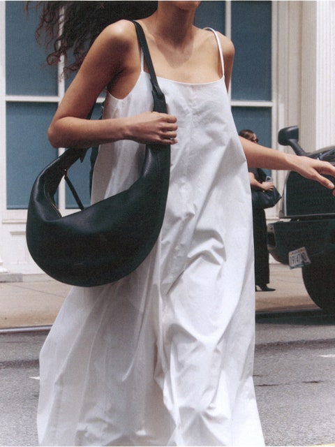 Image may contain: Accessories, Bag, Handbag, Clothing, Dress, Purse, Formal Wear, Person, Fashion, Gown, Adult, and Car