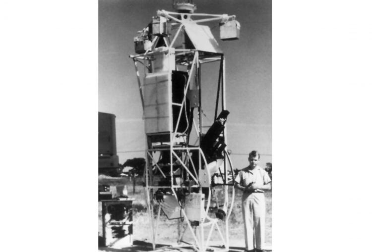 1960: Extended observation of the intermediate corona was the ultimate purpose of balloon experiments such as the one pictured. This project used an unmanned stratospheric balloon to raise a coronagraph above the dust and smoke of the lower atmosphere for several hours of continuous operation. At the end of the day's observation, the instrument and its photographs were returned to the ground by parachute. The gondola holding the instrumentation was the same one used by Princeton physicist Martin Schwarzschild to take images of the solar granulation with his 'stratoscope' in 1959. The first two successful deployments of Coronascope-I were made outside of Minneapolis, in cooperation with the General Mills Company, in September and October of 1960. An improved version of the instrument, The Coronascope II, was launched at the National Scientific Balloon Facility in Palestine, Texas in March of 1964 and produced the first images of the outer corona without a solar eclipse. The Coronascope II instrument flew in two other flights in 1965 and served as a test-bed for the development of the HAO Skylab coronagraph that was launched into space in 1973.