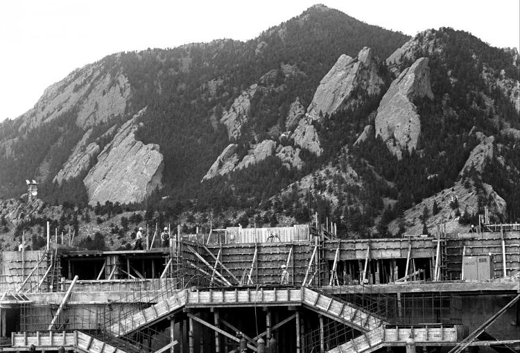 In 1965, NCAR began construction operations in Boulder, Colorado. The building was designed by the architect I. M. Pei who decided not to compete with the scale of the Rockies but to make a building that was without conventional scale. Pei designed NCAR to impinge minimally on the vegetation and topography of Boulder’s Mesa by returning to elemental forms of sheer walls and unfinished concrete the color of the mountains. The National Center for Atmospheric Research (NCAR) was dedicated in Boulder, Colorado on May 10, 1967.