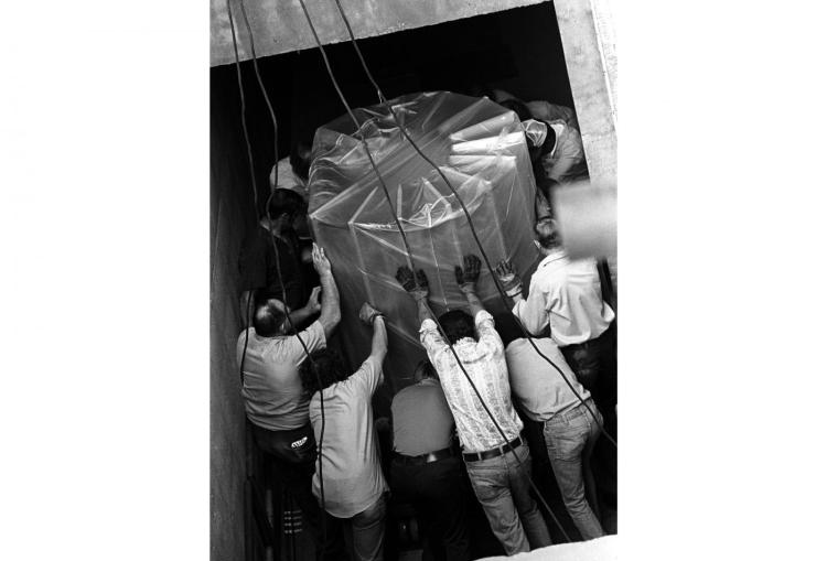 1977: NCAR accepts the first production model of the CRAY-1 supercomputer. The five-ton machine is lowered through the ceiling of a newly built underground computing center. Subsequent machines from Cray Research dominated NCAR computing into the 1990s.