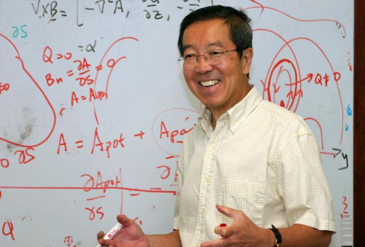 2006: HAO scientist Boon Chye (known as BC) Low gives a talk in front of a white board full of equations. Dr. Low was a senior scientist at NCAR (retired). He studied the solar atmosphere, with particular interest in the theory of basic physical processes and the solar corona as an integral natural system. He is also interested in applied and computational mathematics and collaborates with colleagues in the Institute of Mathematics for Geosciences.
