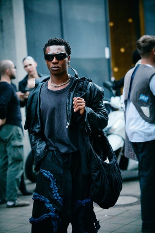 Image may contain Linda Efler Accessories Glasses Jewelry Necklace Clothing Footwear Shoe Adult Person and Bag