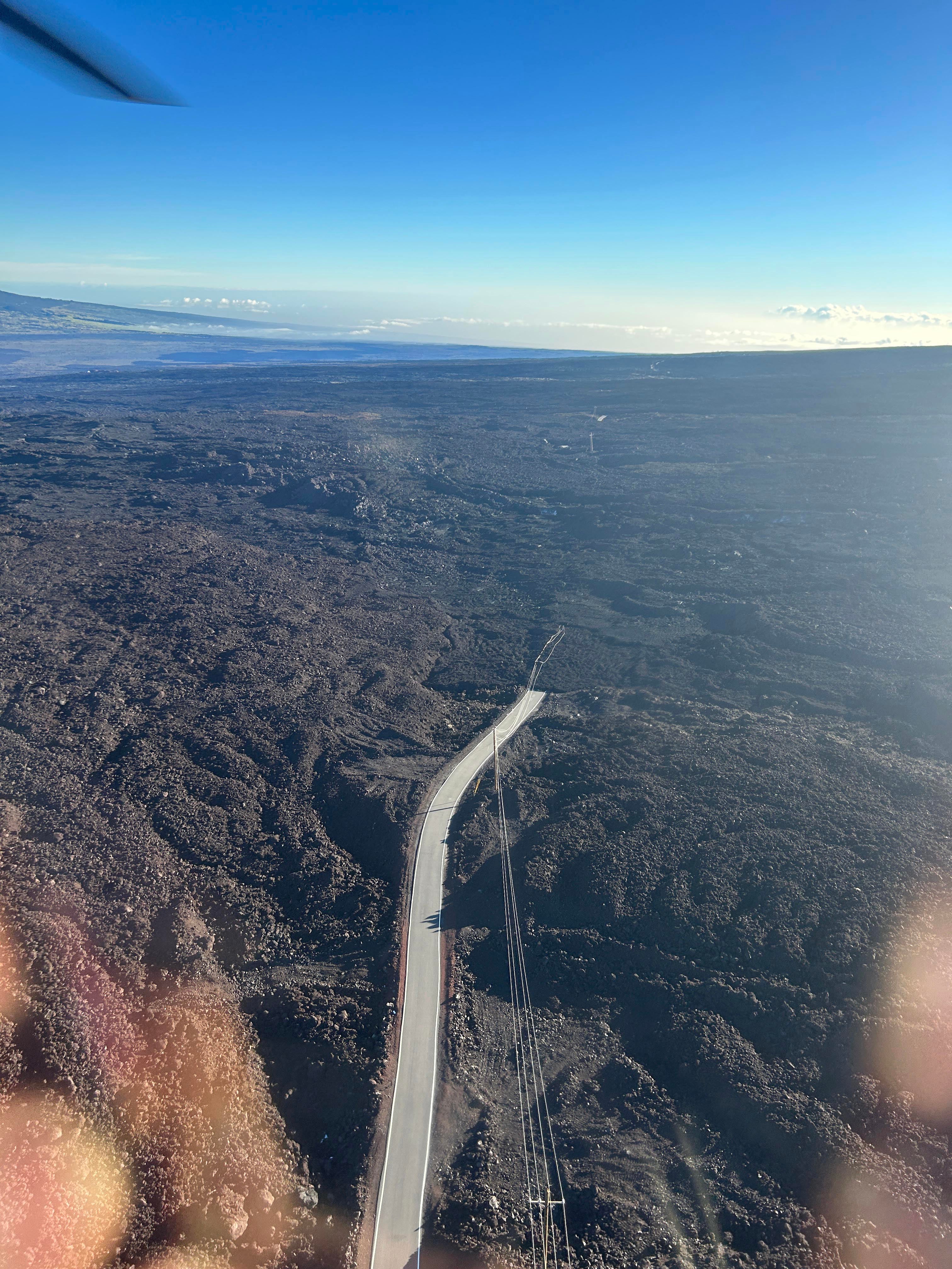 Lava flows from fissure 3 destroyed approximately a mile of the road and power lines