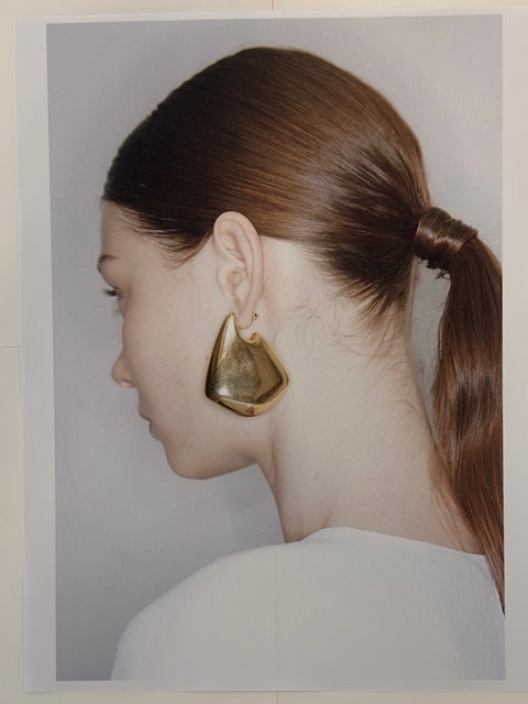 Image may contain: Accessories, Earring, Jewelry, Face, Head, Person, Photography, Portrait, Adult, and Hair