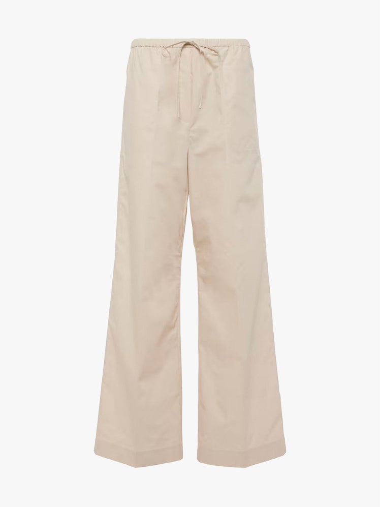 Image may contain Clothing Pants Skirt Home Decor Linen and Khaki